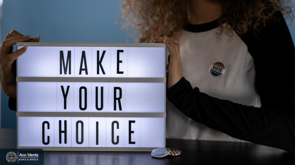 Person holding a "Make Your Choice" sign representing the decision to hire a qualified truck accident lawyer.