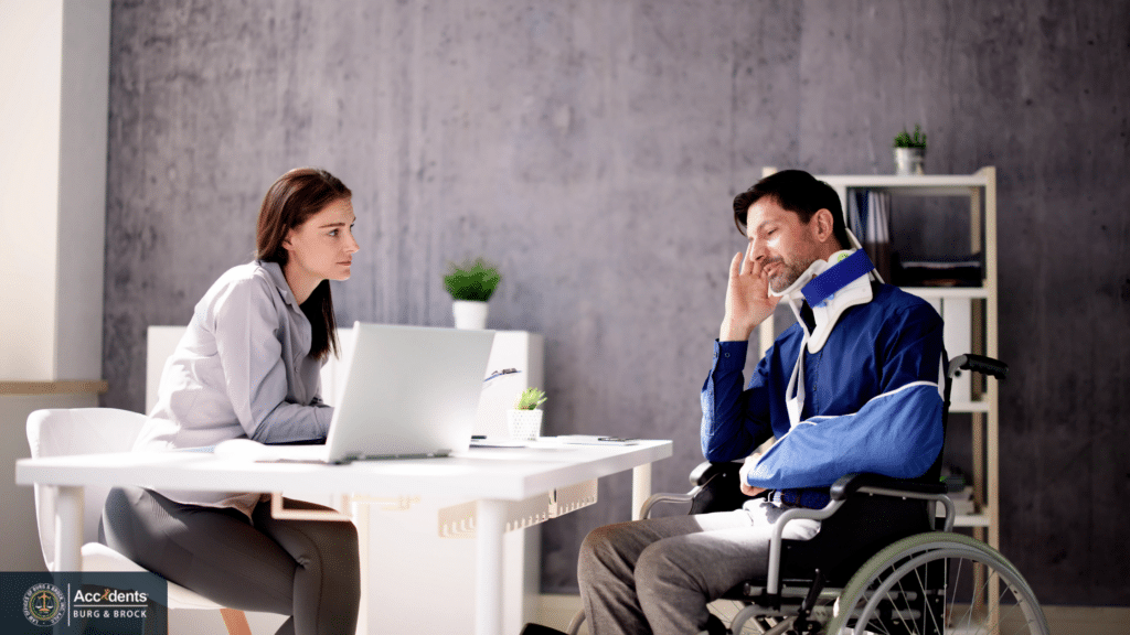 Truck accident victim wearing a neck brace and arm sling meeting with a personal injury lawyer to discuss a compensation claim.
