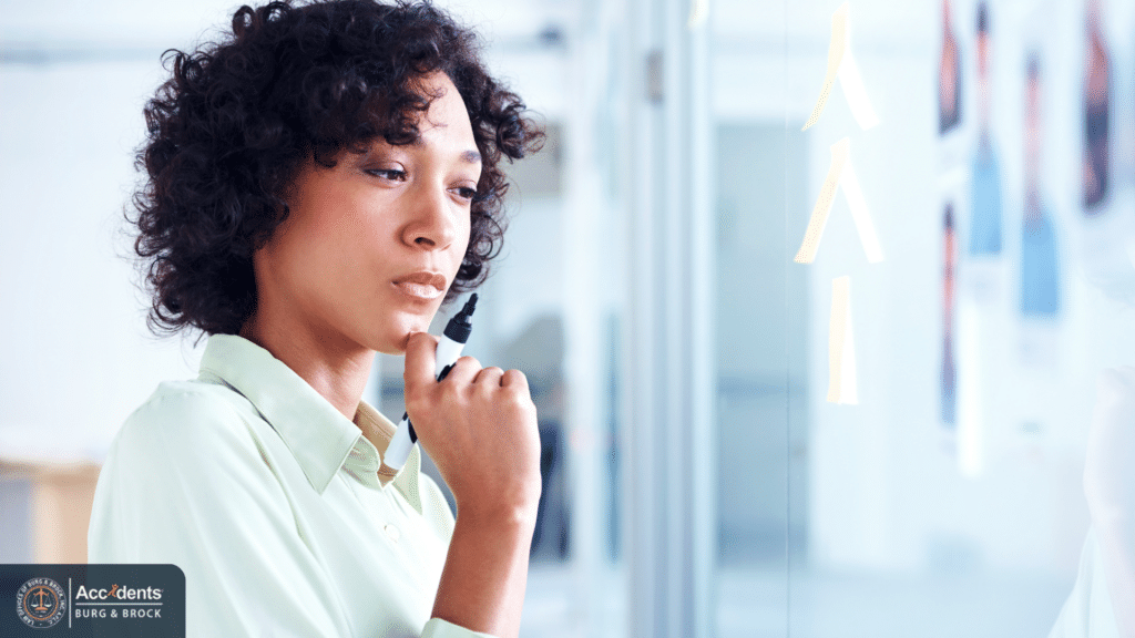 Person thoughtfully reviewing options before making an accident settlement decision