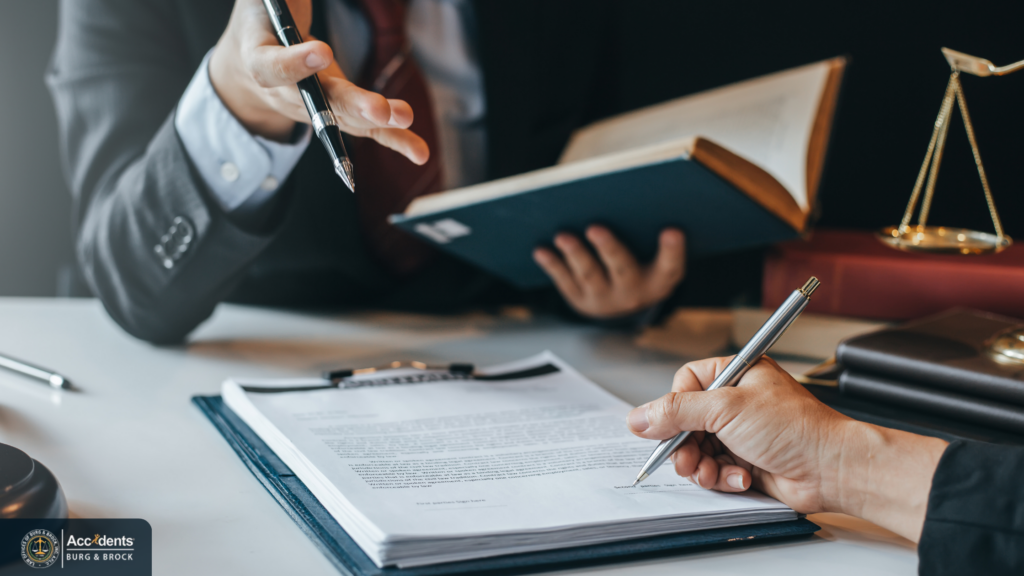 California wrongful death attorney reviewing legal documents with a client.